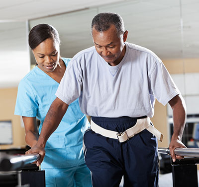 Therapist with patient doing gait training